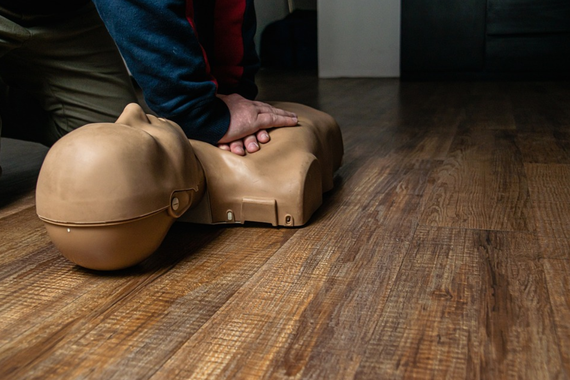 Advanced first aid course training with AED and CPR gear